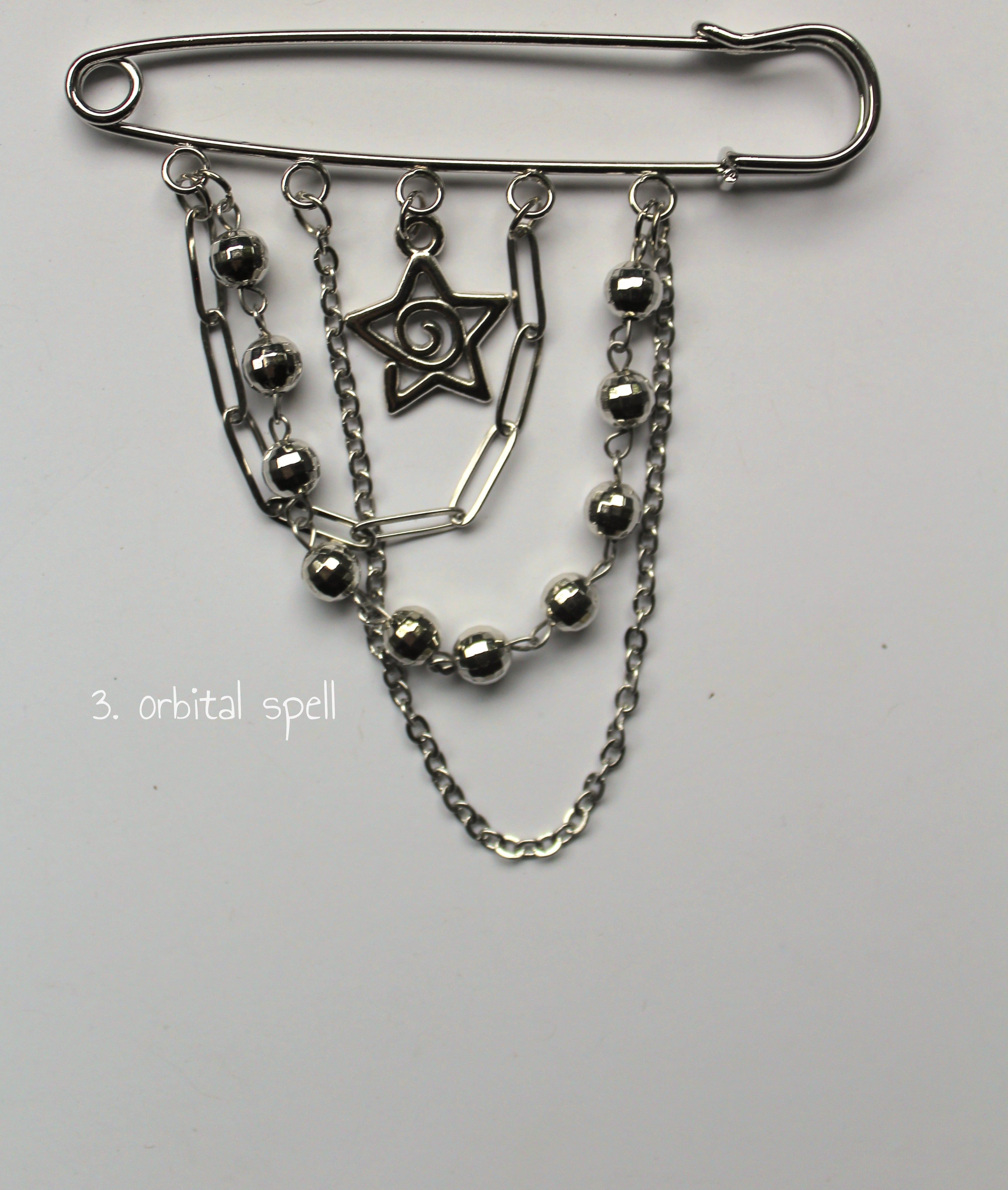 Orbital spell pin